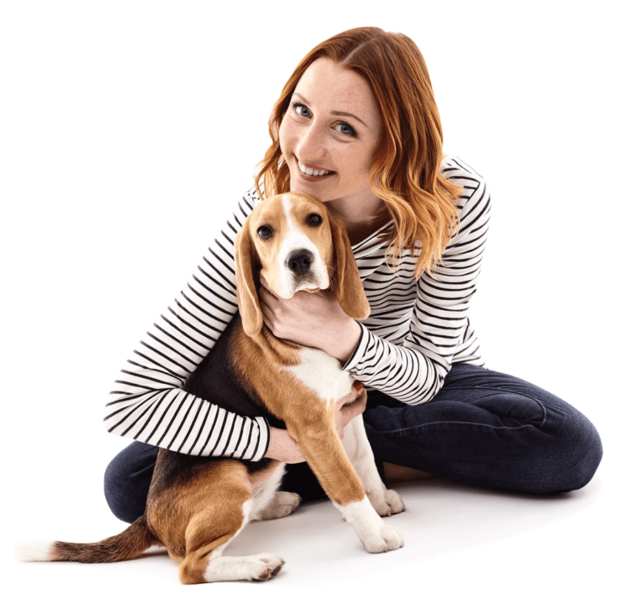 woman hugging a beagle